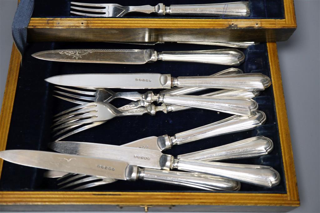 Six silver cake forks, six silver coffee spoons and six silver apostle teaspoons (all cased) and six pairs of dessert eaters